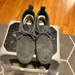 Uggs moccasin style booties. Between a navy and a dark gray.